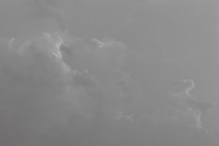 Gray storm clouds weather change rain sky background gray nature.の写真素材