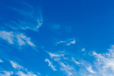 Bright blue sky in the evening with white soft clouds natural background weather air.の写真素材