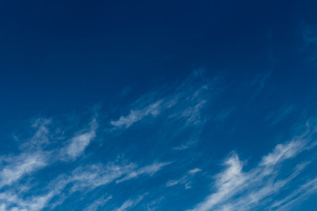 Dark blue sky atmosphere with white air clouds weather wind nature background.の写真素材