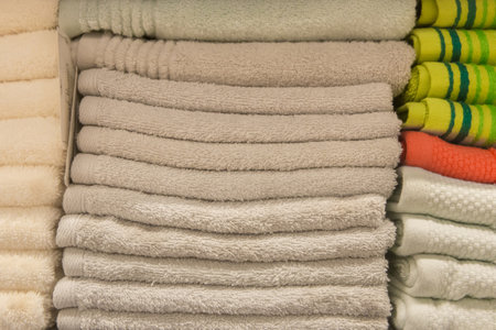 Set pile stacked gray white color fabric gray towels object hygiene bathroom concept, close up.の写真素材