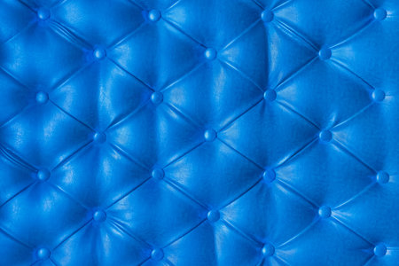 Blue leather upholstery sofa pattern button design furniture style decor texture background decoration vintage abstract.の写真素材