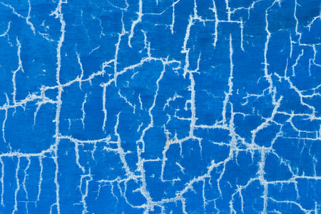 Old cracked surface blue crack concrete broken wall cement damaged background pattern.