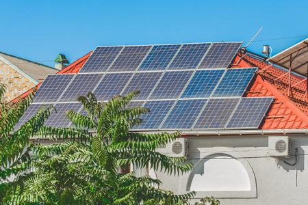 Solar thermal panels alternative energy green environment ecology on the roof of the house against...