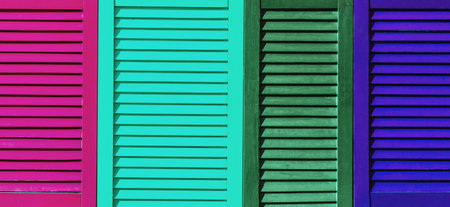 Part of modern interior with colorful patterned texture of wooden colored shutters, casements or blinds background.の写真素材
