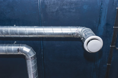 Ventilation pipe system at the ceiling of an industrial enterprise or plant premises.の写真素材
