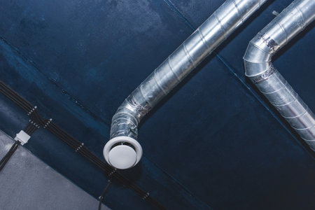 Ventilation pipe system at the ceiling of an industrial enterprise or plant premises.の写真素材