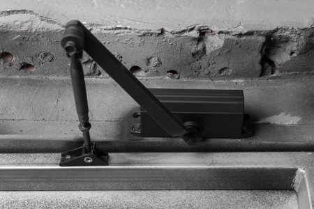 Door stopper open object doorstop indoor door stopper metal stop device close up.の写真素材