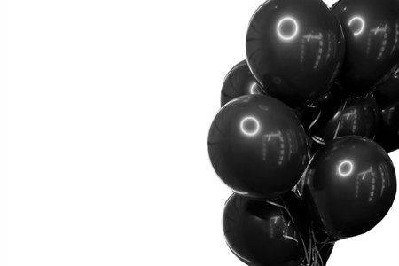 Black stylish helium air balloons for a modern holiday festival on white isolated background.の写真素材