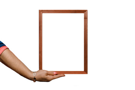 Hand holds a blank white space frame mock up for text and background design isolated.