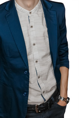 Men's business style clothing fashion vintage light shirt and blue jacket posing with hand in pocket...