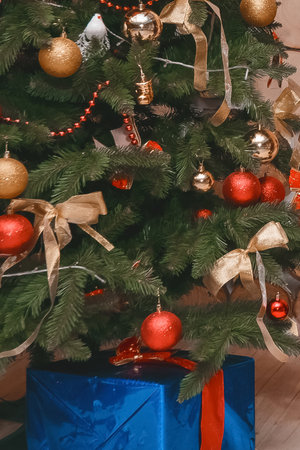 New Year beautiful Christmas tree decorated in the interior of the room, close up.の写真素材