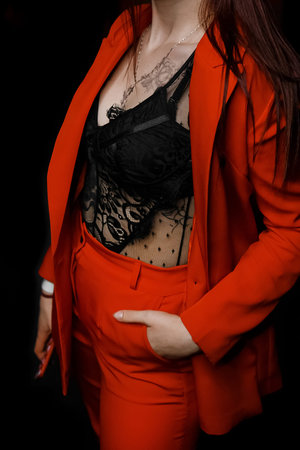 Fashionable young girl clothing style red suit and jacket with black half-sighted bodysuit with...