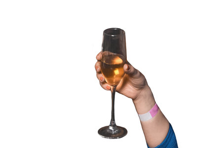 The hand of girl glass of alcoholic beverage on a white background, isolated, holiday atmosphere, weekend.の写真素材