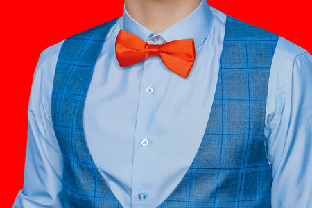 Men's clothing style fashion bow tie shirt and vest on color isolated background.の写真素材