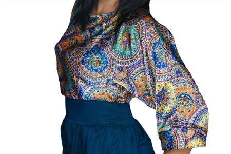 Women's fashion and fashion style bright blouse with abstract color pattern and blue skirt close-up on white isolated background.の写真素材
