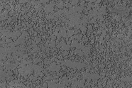 Plaster dark gray wall stucco decoration surface texture background structure grunge backdrop.の写真素材