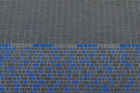 Dark gray and blue color floor tile stone texture surface street city background road.の写真素材