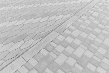 Two Kinds Paving Tiles Dividing Border Curb Mosaic Stone Street Road City Texture Background Light White.の写真素材