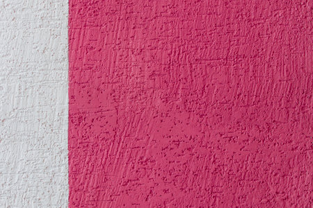Pink rough wall abstract pattern two colors and white plaster texture background design space blank empty template.の写真素材
