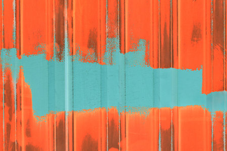 Aqua-blue paint brush strokes abstract wall design blank space for text empty orange background pattern metal fence old.の写真素材