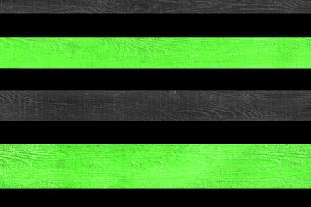 Green light verdant bright horizontal lines stripe wooden fence board black background isolated plank object.の写真素材