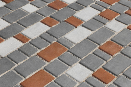 Gray brown diagonal lines stripes pattern paving slabs floor stone mosaic street city texture background structure tile.の写真素材