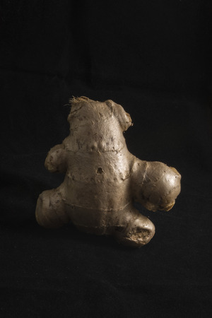 ginger with funny character shape on black backgroundの写真素材