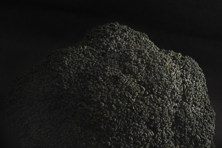 Couple of cauliflower and broccoli on a dark background, with theatrical lighting. Fresh vegetables. Dark cauliflower.の写真素材