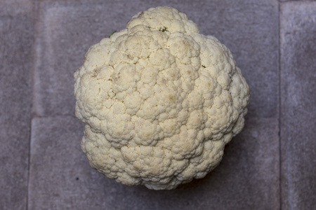 Couple of cauliflower and broccoli on a dark background, with theatrical lighting. Fresh vegetables. Dark cauliflower.の写真素材