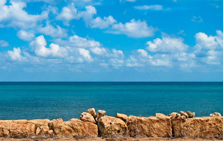 sea sky and rocks in foreground