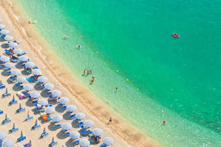 aerial view of people relaxing on beach on hot summer day on Amalfi coat, Italyの写真素材
