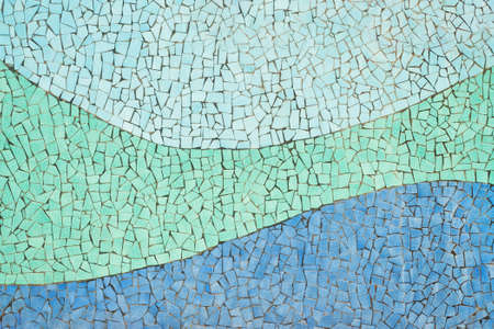 tiled ceramic mosaic wall with blue wavy lines in public park in city of ceramics, Vietri Sul Mare, Salerno, Campania, Italyの写真素材