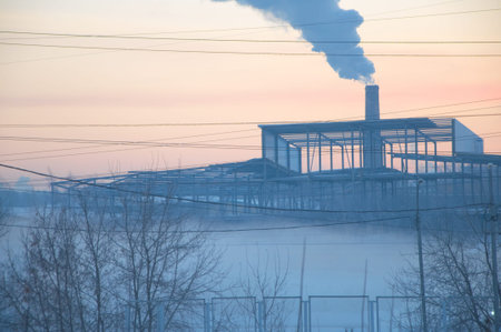 Misty morning in the industrial city at sunsetの写真素材