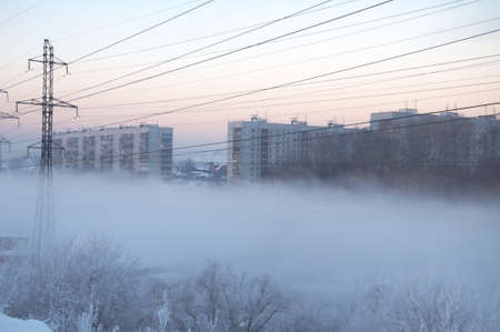Winter city at the fog in Siberiaの写真素材