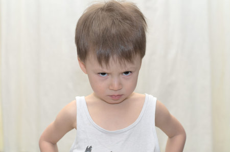 Caucasian boy in a gloomy mood