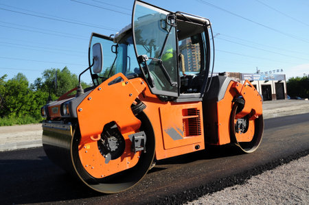 Rolling machinery at work making asphalt. Doors opened