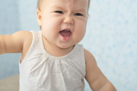 funny cheerful caucasian baby girl smiling portraitの写真素材