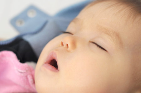 Baby sleeping with open mouth daytime sleep
