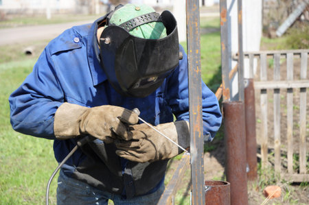 welder outdoor working and soldering iron with mask