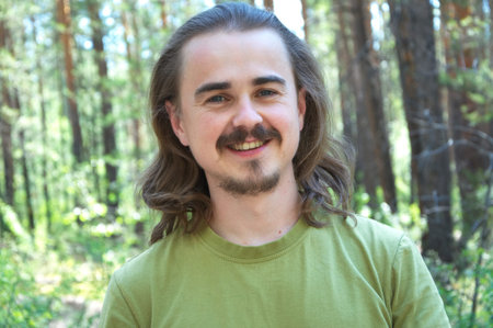 Man portrait smiling in the forestの写真素材