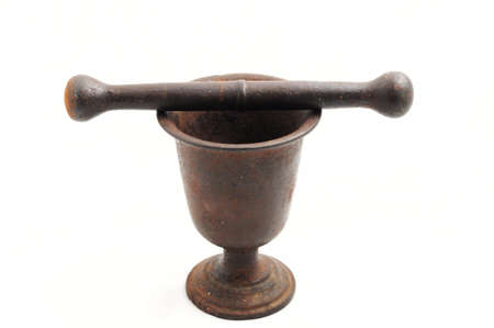 Vintage pounder with a pestle isolated on whiteの写真素材
