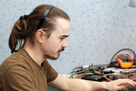 Young hardware and software programmer at workの写真素材