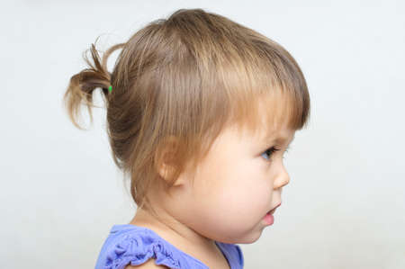 Tiny ponytail style - baby girl first hair styleの写真素材