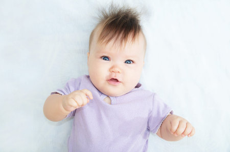 Infant baby portrait looking at camera