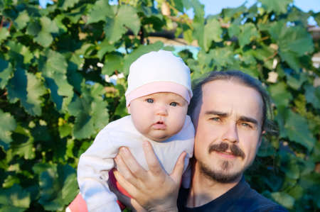 Father with baby girl daughter at summer. Happy family portraitの写真素材