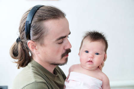 Infant baby with father, happy fatherhood, young familyの写真素材