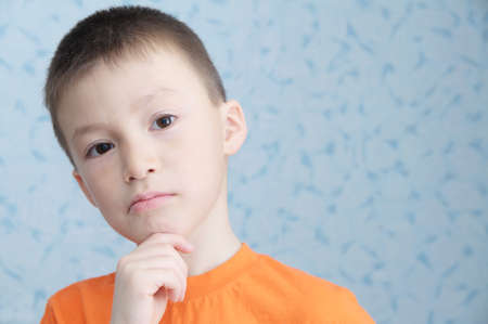 Idea thinking adorable boy portrait closeup, solving problem conceptの写真素材