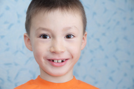 Happy Adorable boy at 7 age portrait closeup, Caucasian child, second dentition at preschool age