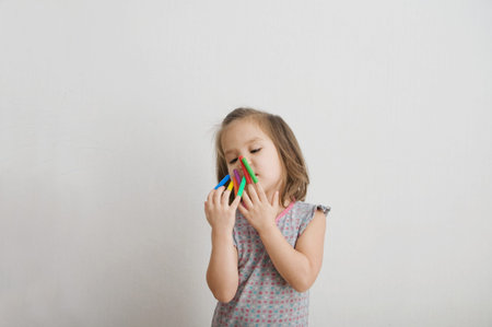 little girl playing with felt tip pens stuff. baby girl painting and playing. colorful felt pen caps...
