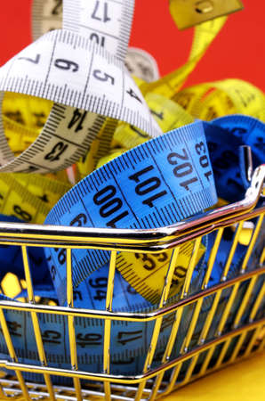 shopping cart with measure tapeの写真素材